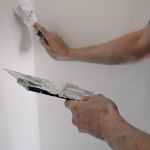 crop man working with putty at home